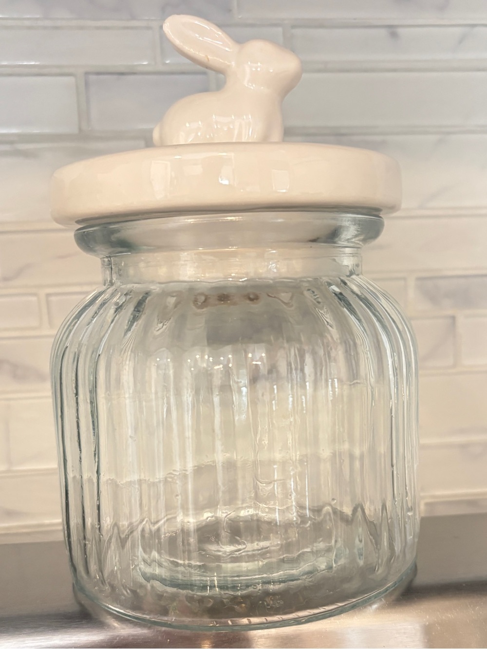 Glass jar with ceramic lid. White rabbit. Bunny.